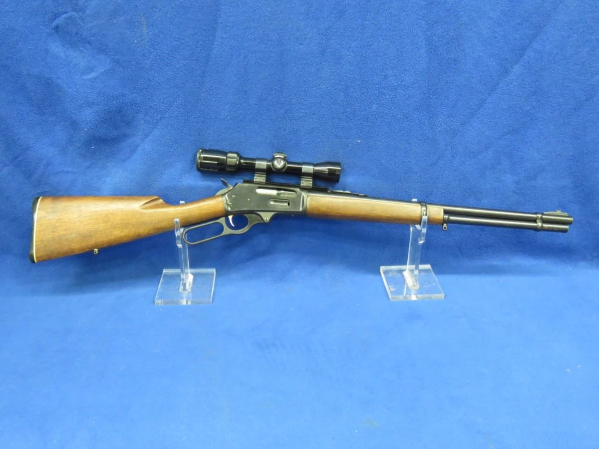 Lot 9. Marlin Model: 336, S/N: AB30312, 44-Mag lever-action rifle with a leather sling and hard case. The gun is in fair to good condition with pitting and some rust.