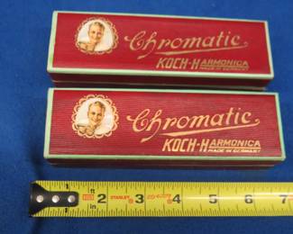 Lot 358. Two like-new empty Koch Harmonica Chromatic hinged boxes