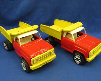 Lot 22. Two matching vintage Tonka dump trucks that have been repainted.