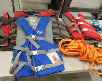 Lot 417. Four adult life jackets, tow ropes and more