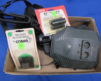 Lot 38. 12-gauge snap caps, an old trail camera, and more