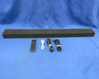 Lot 246. 36" Vizio sound bar in good working condition. Had HDMI and Bluetooth. Includes remote, HDMI cable, power cable, and aux cable.