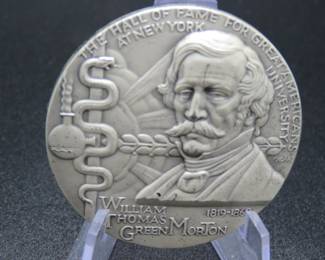 Lot 301. Medallion weighing 2.14 troy ounces of .999 pure silver from The Hall of Fame for Great Americans Series featuring William Thomas Green Morton. Made by the New York Medallic Art Co.
