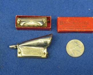 Lot 357. Vintage C.A. Seydel mini 1 1/2" 5-hole working harmonica and box.  Vintage Johann Schunk 2 1/4" mini 5-hole Baby Hornola. 