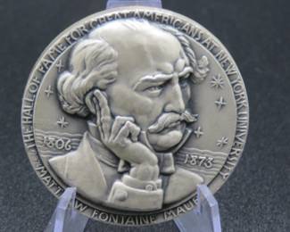 Lot 308. Medallion weighing 2.289 troy ounces of .999 pure silver from The Hall of Fame for Great Americans Series featuring Matthew Fontaine Maury. Made by the New York Medallic Art Co.