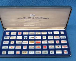Lot 20. Complete collection of the Official Emblems of the World's Greatest Airlines. 140 grams of sterling silver with vibrant enamel capturing the intricate designs and fine craftsmanship of some of aviation's past and present logos.  Also included are descriptive cards that describe the history of each airline represented.