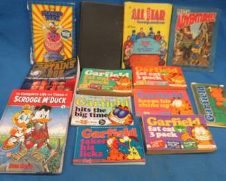 Lot 394. Vintage hard and soft-covered books, including Disney, Superman, Star Trek, Garfield, and more