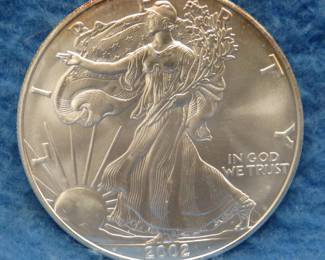 Lot 12. 2002 American Silver Eagle. One ounce of .999 fine silver.