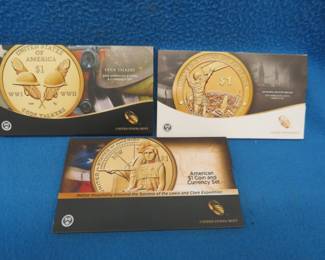 Lot 377. Three $1 coin sets each with one Sacagawea Dollar and one $1 uncirculated Federal Reserve Note