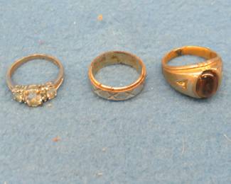 Lot 168. Three rings. One marked 18kt HGE and one Tiger's Eye.