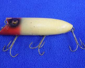 Lot 212. Vintage Heddon 4" wooden Basser with glass eyes