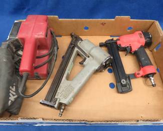 Lot 382. Two pneumatic nailers and a Skill belt sander