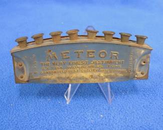 Lot 118. Rauner diatonic harmonica with eight grommets