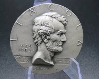 Lot 347. Medallion weighing 2.106 troy ounces of .999 pure silver from The Hall of Fame for Great Americans Series featuring Abraham Lincoln. Made by the New York Medallic Art Co.