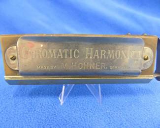Lot 80. Hohner 10-hole chromatic harmonica in the key of C. Cracked comb. Works