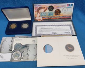 Lot 374. Coin Mixed bag: WWII Anniversary - V-J Day Commemorative cover and two medallions. Two Ronald Reagan medallions. Two JFK 50th anniversary unc. half dollar coins. Four 1989 Franklin Mint Christmas Cards with medallions.