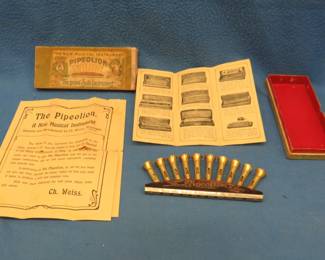 Lot 17. Christian Weiss antique "The Pipelion" 10-horn diatonic harmonica, box, and papers. Minimum bid $300. Introduced in 1907, this harmonica was made for about four or five years and never copied. Each of the 10 horns has a blow reed and a draw reed. 