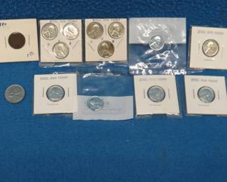Lot 314. Twelve 1943 steel pennies in very good condition, an 1890 Indian Head penny, and a 1969 Canadian quarter.