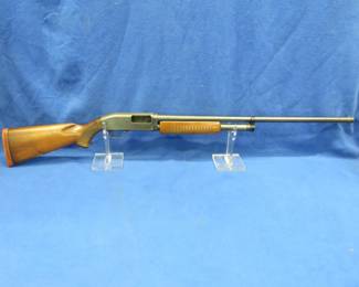 Lot 324. J.C. Higgins Model 20, NSN, 12-gauge pump-action shotgun with a fixed full choke. Pitting in barrel and action and appears to have water damage on the stock.