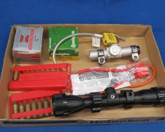 Lot 325. 31 mixed 44 Mag rounds, two scopes as pictured, and two gun locks