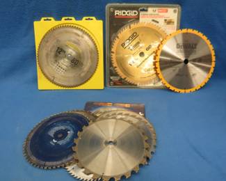 Lot 31. Various size saw blades including two new 12" blades