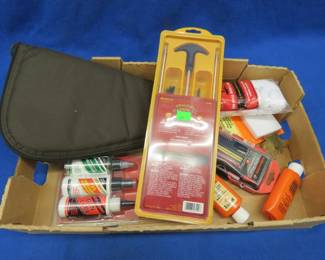 Lot 102. Gun cleaning items and a soft pistol case