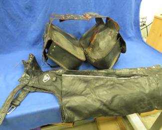 Lot 467. Leather chaps, size Medium, from Buffalo Leather and a pair of saddle bags that are in poor condition.