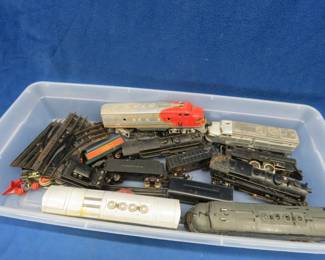 Lot 366. Vintage Lionel trains in different sizes and a couple of track sections