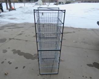 Lot 249. Eight-drawer wire basket sliding storage bin. Can be separated into two four-drawer organizers. H: 55 1/2" x W: 17 1/2" x D: 21"