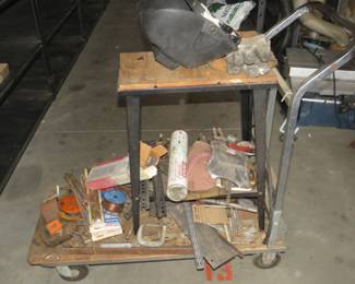 Lot 222. Welding cart with contents including some wire, rod, and materials