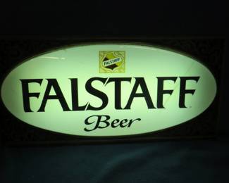 Lot 403. Working lighted Falstaff Beer sign with a metal base. There is a tight crack in the front.