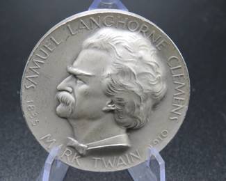 Lot 350. Medallion weighing 2.007 troy ounces of .999 pure silver from The Hall of Fame for Great Americans Series featuring Mark Twain. Made by the New York Medallic Art Co.