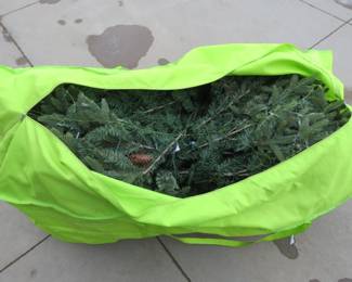 Lot 250. 9-foot Pre-lit Hayden Christmas tree in storage bag. Seller states it was used for one season and all worked as it should.