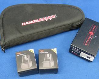 Lot 100. Crimson Trace Rail Master, two magazine loaders, and a soft pistol case