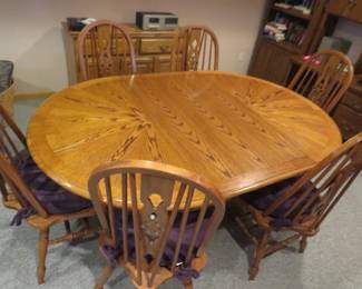 Lot 486. Dining room table, leaf, and six chairs. With the leaf installed: 71'W x 30"H x 47 1/2"D