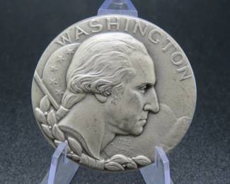 Lot 346. Medallion weighing 2.317 troy ounces of .999 pure silver from The Hall of Fame for Great Americans Series featuring George Washington. Made by the New York Medallic Art Co.
