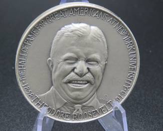 Lot 342. Medallion weighing 1.993 troy ounces of .999 pure silver from The Hall of Fame for Great Americans Series featuring Theodore Roosevelt. Made by the New York Medallic Art Co.