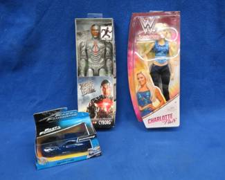 Lot 367. Two action figures and a Die Cast car