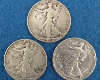 Lot 231. Three Walking Liberty half dollars. 1938 P, 1942 P, and 1945 P.