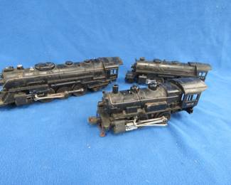 Lot 426. Three old railroad cars: Lionel steam locomotive #2056. Works. Lionel steam locomotive labeled 027 and numbered 1615. Works. Lionel steam locomotive numbered 239. Works.