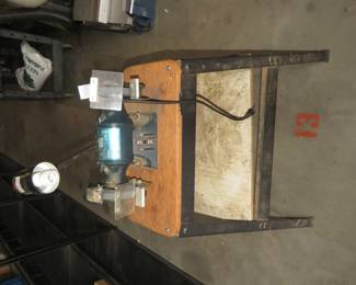 Lot 220. Black & Decker bench grinder with a stand and light