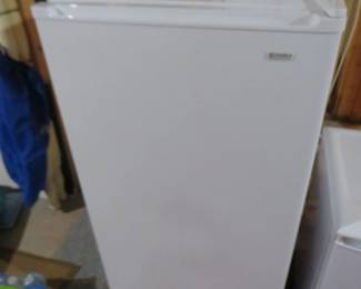 Lot 484. Smaller upright freezer. 21'W x 47"H x 26'D