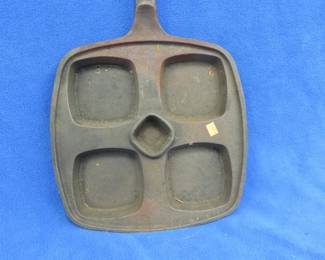 Lot 427. Made in the USA cast iron Eggs Benedict pan.