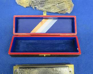 Lot 355. Vintage like-new Hohner 12-hole Super Chromonica harmonica in the box and in the key of C made in Germany. Has a small crack as seen in the photos. Sounds great. Minimum bid $30. 