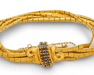 Lot 52
Italian 18k Yellow Gold and Sapphire Multistrand Bracelet 20th Century