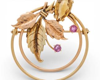 Lot 53
14K Rose and Yellow Gold Circle Brooch, Rubies & Citrine 1960