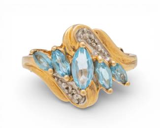 Lot 74
Blue Marquis Topaz Cluster Ring, Size 7, Yellow Gold