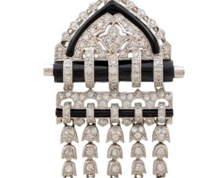 Lot 19
Continental European Art Deco 18K White Gold, Pavé Diamonds, and Black Onyx Pendant / Brooch