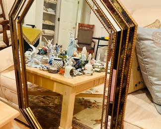 Sexy mirror reflecting many collectables 