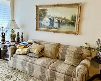sofa, decorative lamp, wool rug, painting